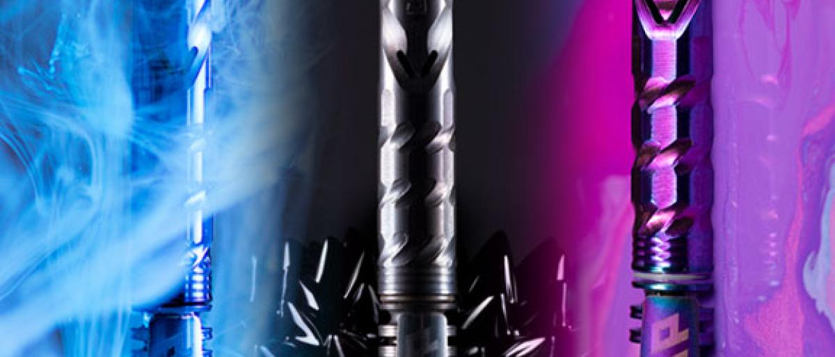 Three colored DynaVap vaporizer pens photographed against smoke and paint backgrounds