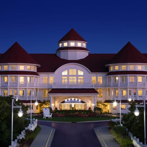 Blue Harbor Resort hotel exterior lit up at night with turret roofs