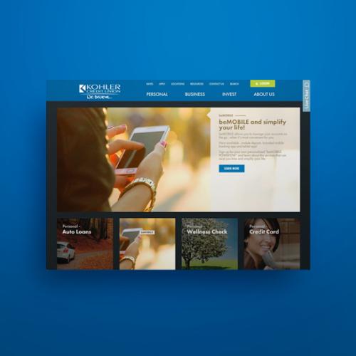 Kohler Credit Union website homepage showing a hand holding a phone for mobile banking