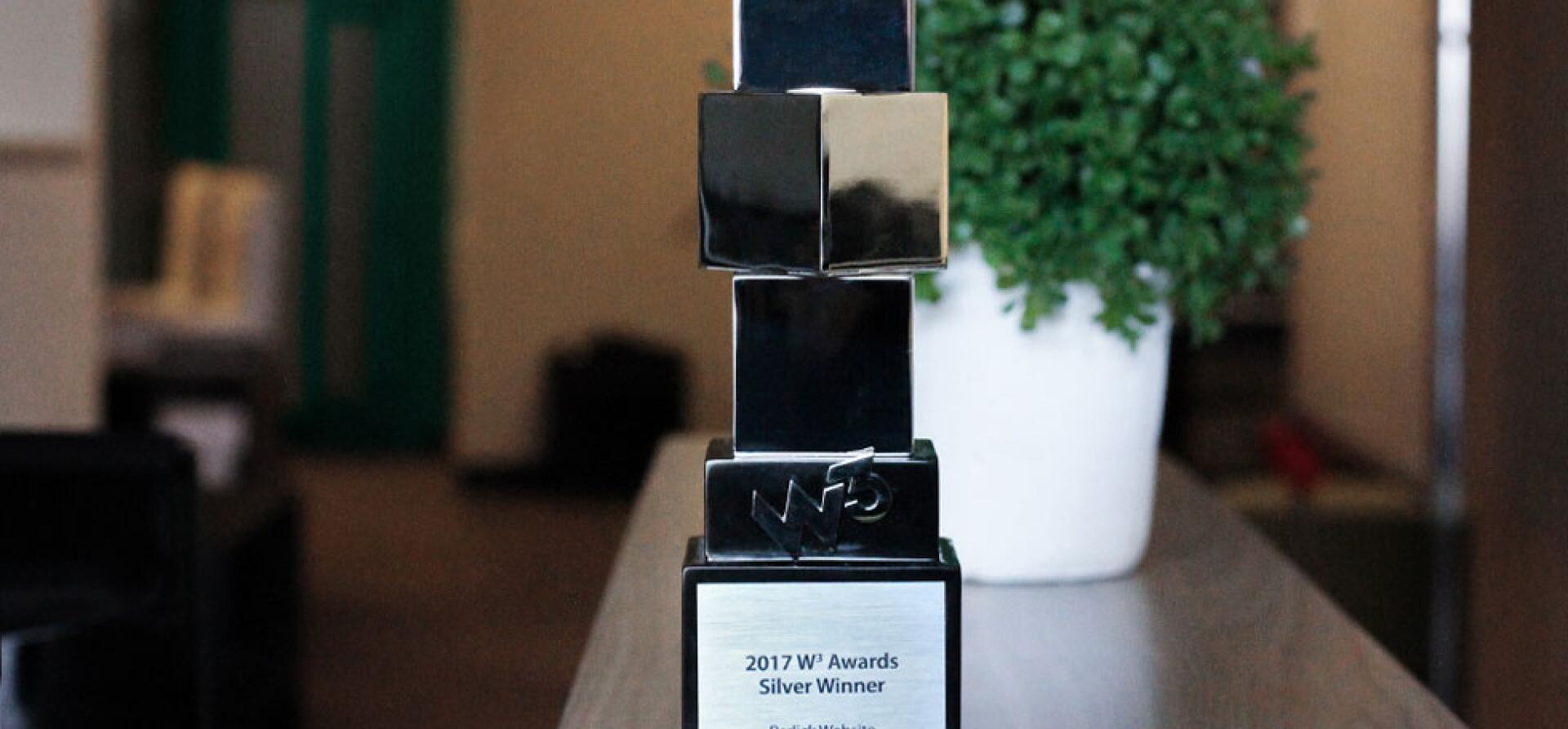 Silver and black cube-shaped trophy for a 2017 W3 Awards Silver Winner, Perlick website