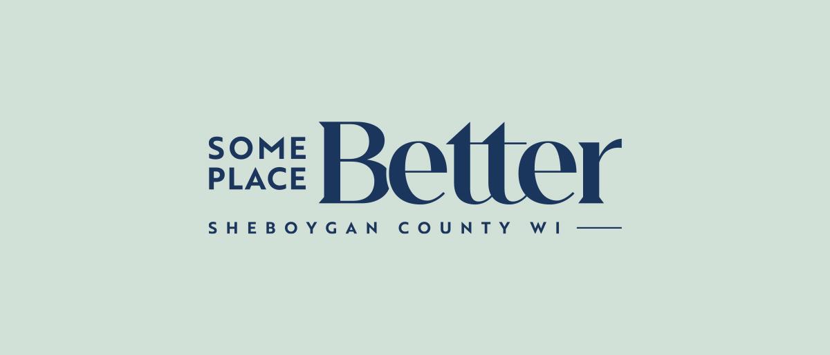 Some Place Better, Sheboygan County WI logo on a mint green background