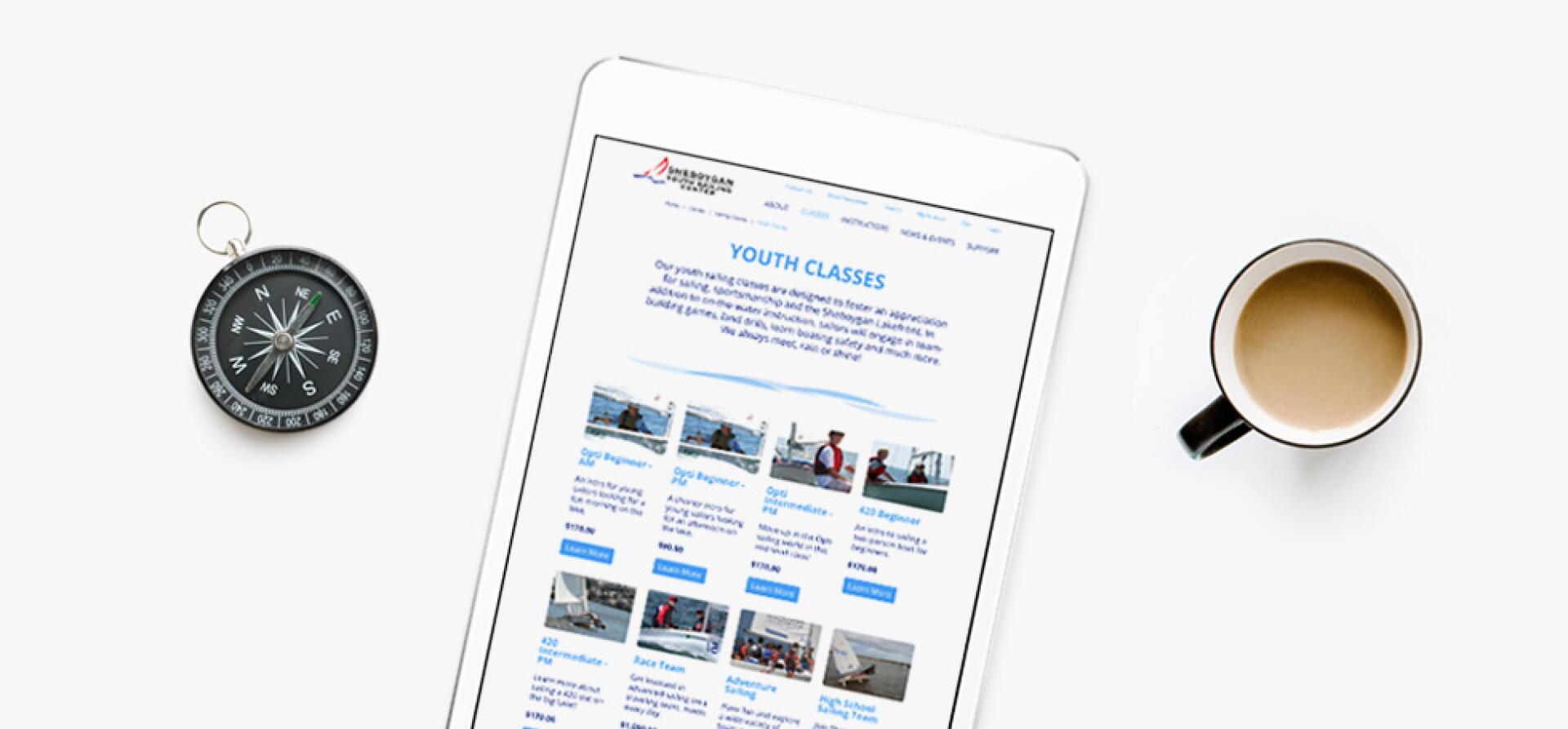 Tablet showing a Sheboygan Yacht Club website page listing youth sailing classes