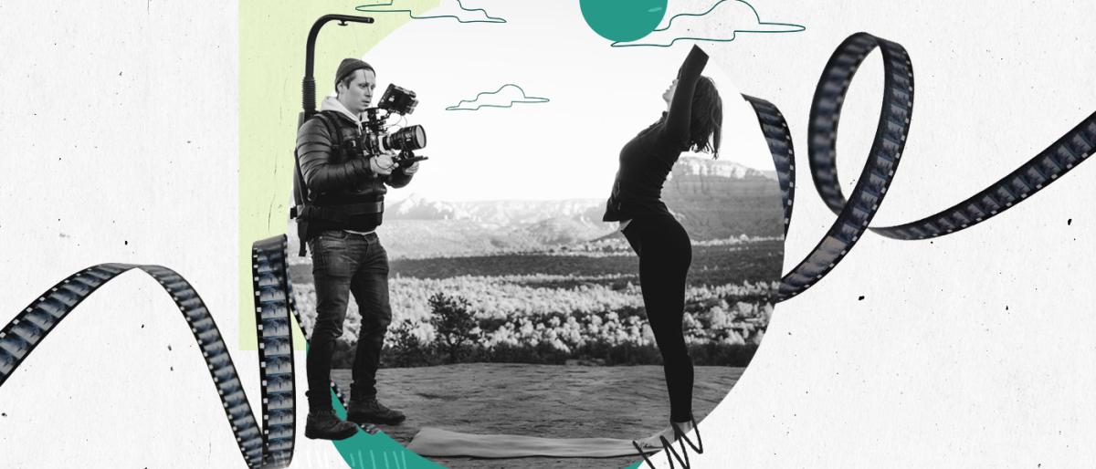Black-and-white photo of a videographer filming a woman stretching outdoors