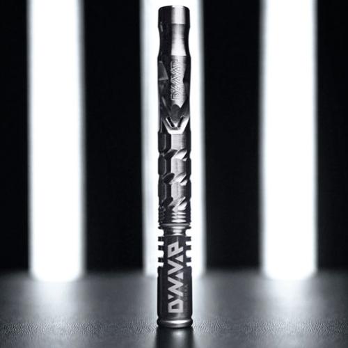 A DynaVap vaporizer pen with a hexagonal textured grip standing against a striped light background